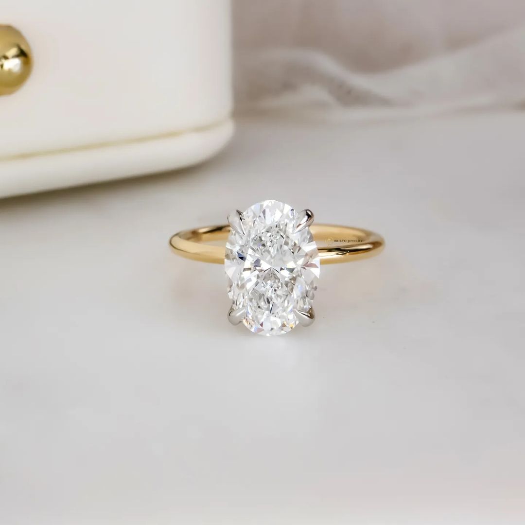 Two-Toned Engagement Ring with Oval and Hidden Halo