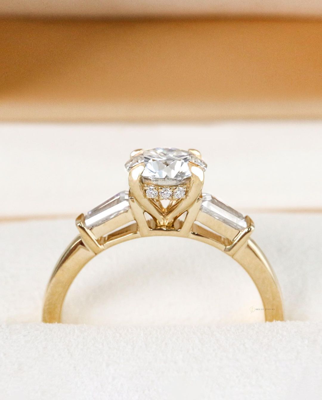 Round Trilogy with Baguette Diamonds and Hidden Halo
